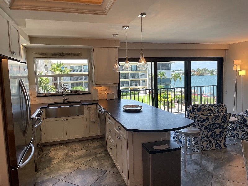 Kitchen/ Family Room on 3rd Floor overlooking Bay and Pool. Views all around. 