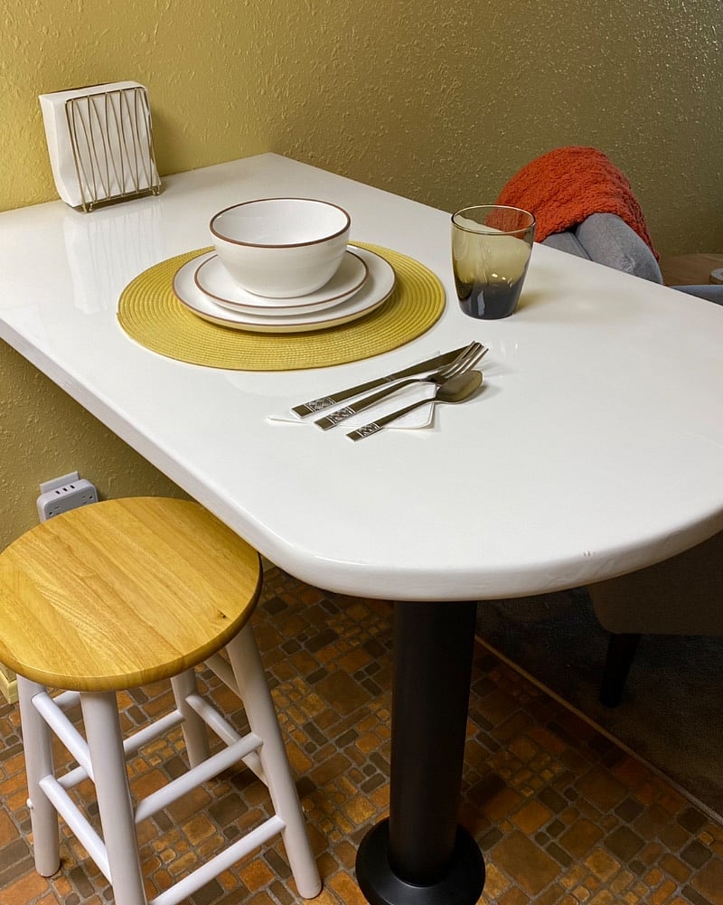 Built-in kitchen table doubles as office workspace.