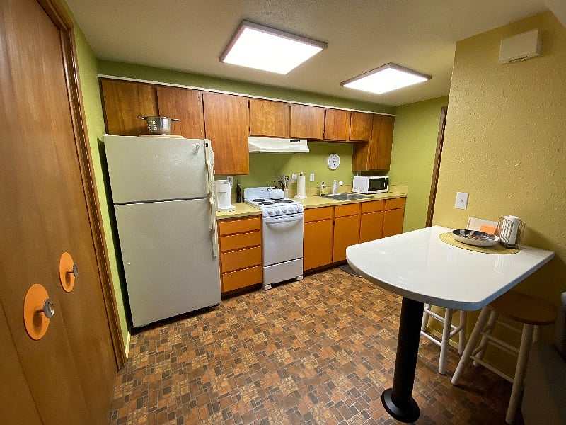 Full size refrigerator-apartment sized stove.