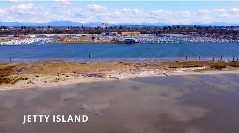 Jetty Island looking toward Everett. Kite Surfing is popular on the 2 mile man made island. The island is open to visitors year-round by personal watercraft, or you can catch a ride on the foot ferry to the island during Jetty Island Days from July 5 thru Labor Day. Jetty Island Days are provided in partnership with the City of Everett and the Port of Everett, bringing more than 50,000 people to the island every summer season.  KayakShare.com offers self-serve kayak and SUP rentals year-round during daylight hours.
