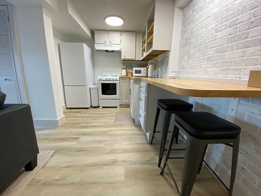 Tall slim full sized refrigerator and apartment sized stove.
