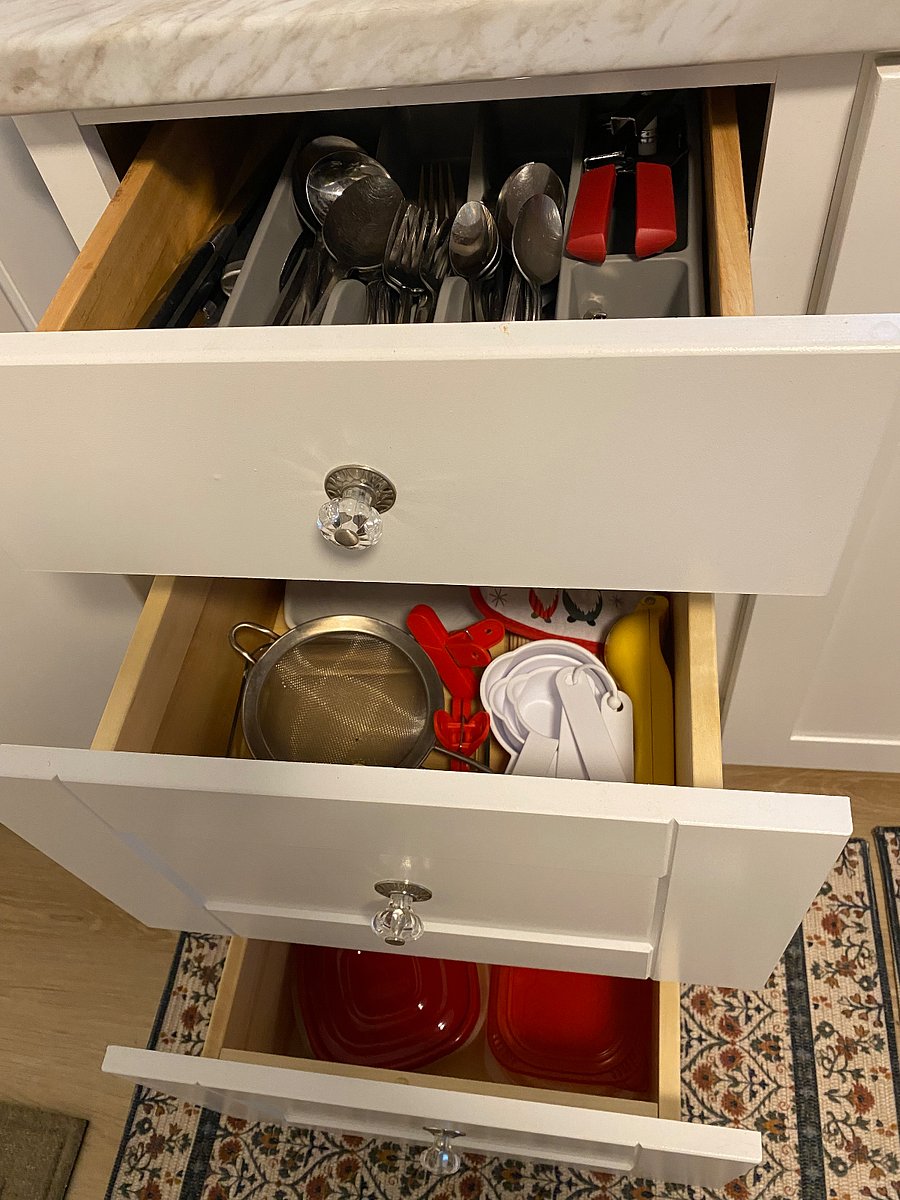 Kitchen towels, silverware, misc kitchen needs.