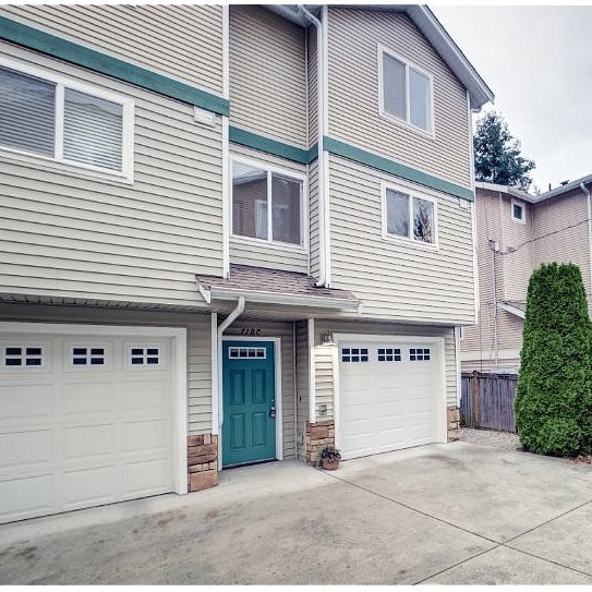 Welcome home! Exterior (unit on right), entrance and garage.