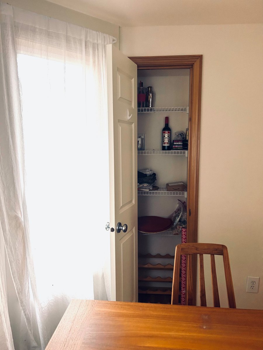 Entertainment closet next to dining area.