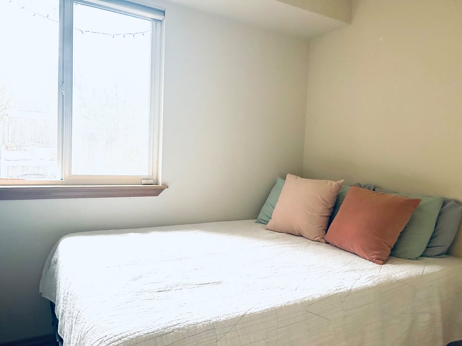 First floor bedroom with private bath and access to back yard.