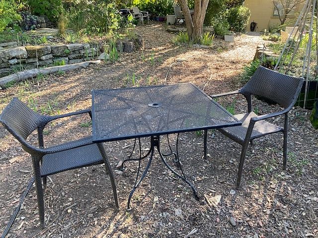 There are two tables for your use in the back yard, and a chaise lounge.