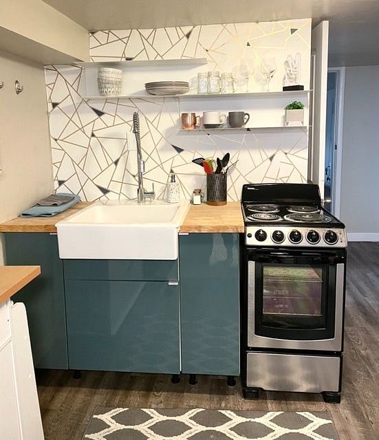 Brand new range installed! Mini fridge is in unit still.