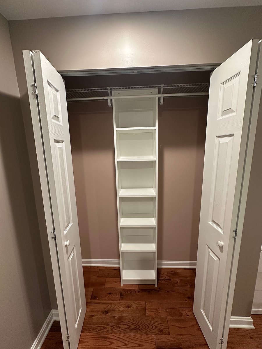 Here is the refreshed closet! Shelving added and hanging height raised!