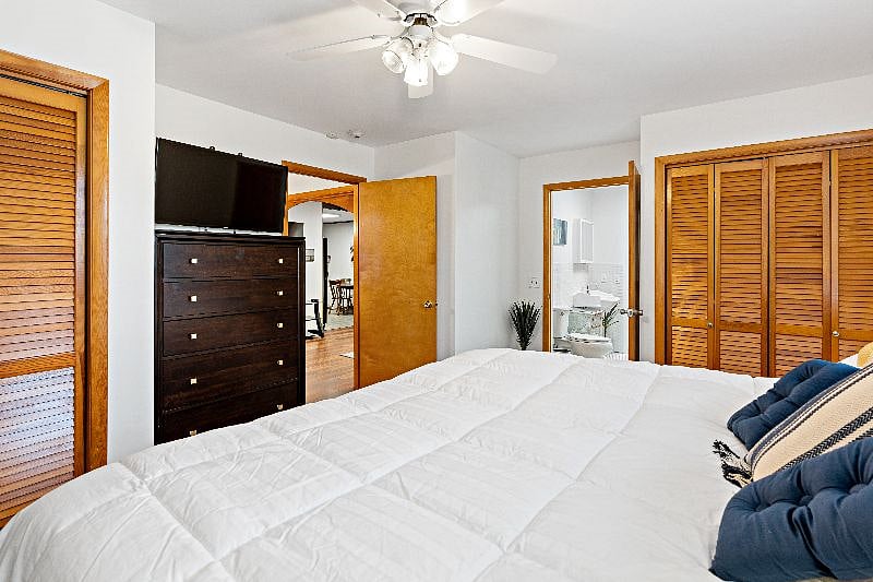 Bedroom 1 with access doors to dinning room and bathroom