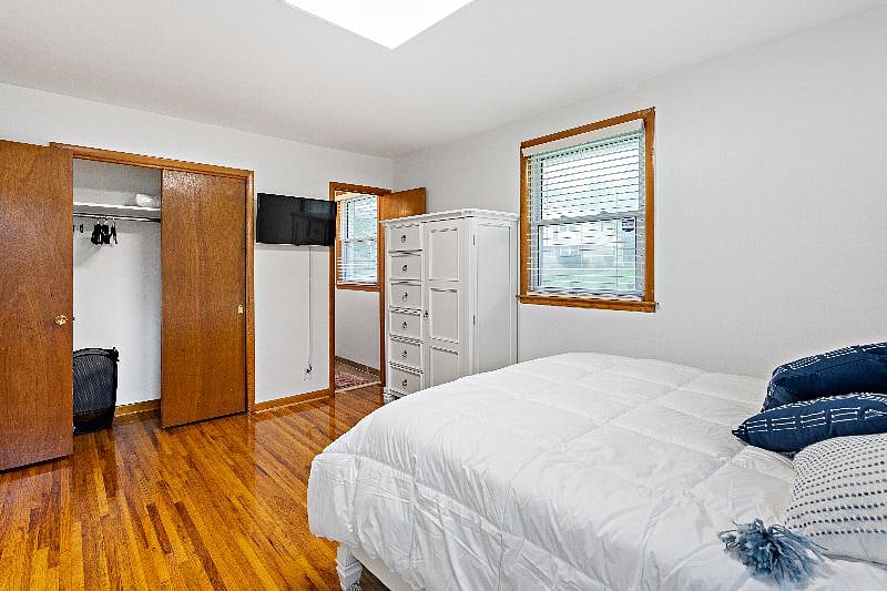 Bedroom 4 with attached half bathroom and closet