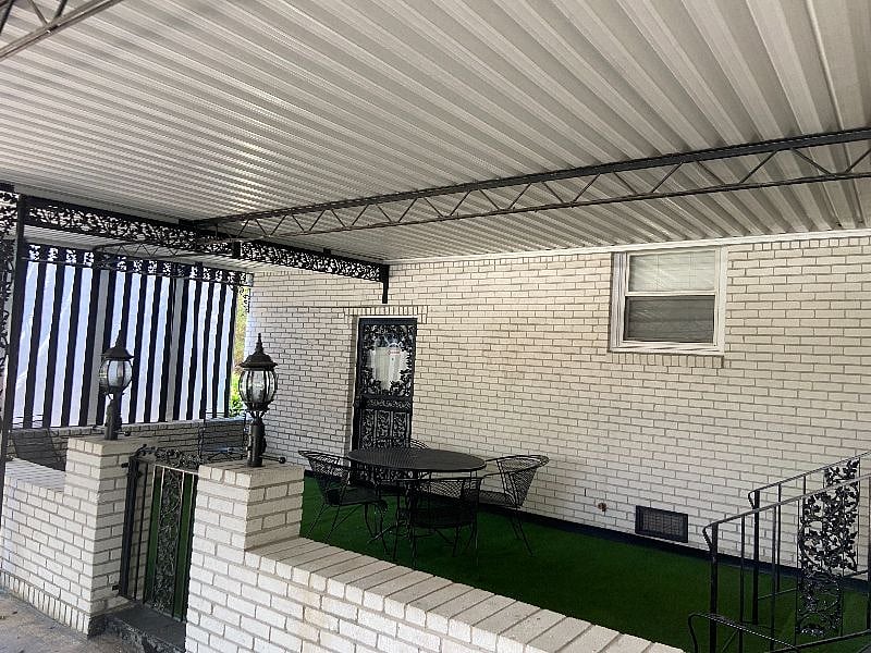 Back door that leads to Patio that leads to carport
