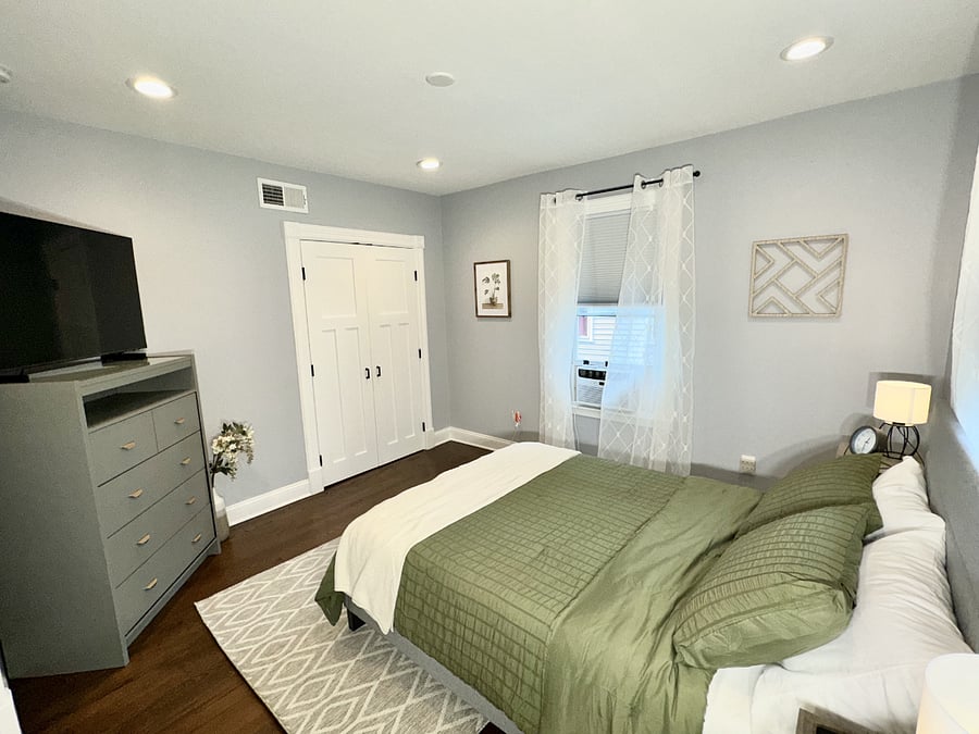 Bedroom 1 with full size bed and ensuite bathroom