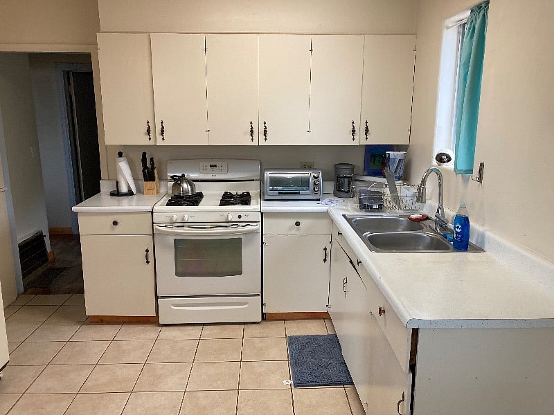 Full kitchen with new toaster oven and new microwave range. 