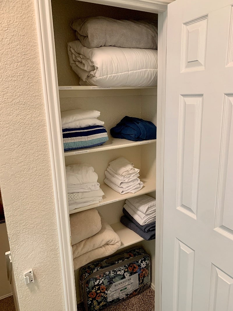 Two linen closets & coat closet by washer/dryer