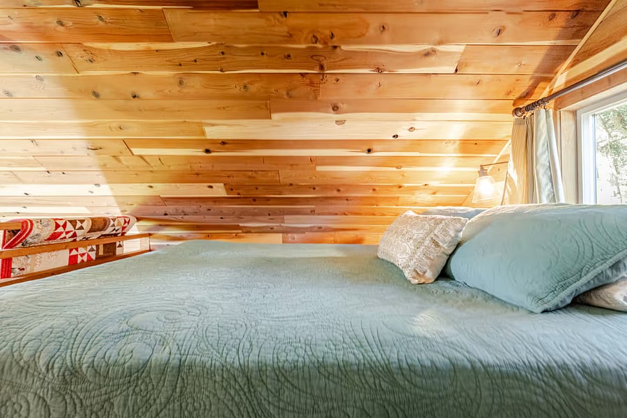 The sleep loft has a queen memory foam mattress.