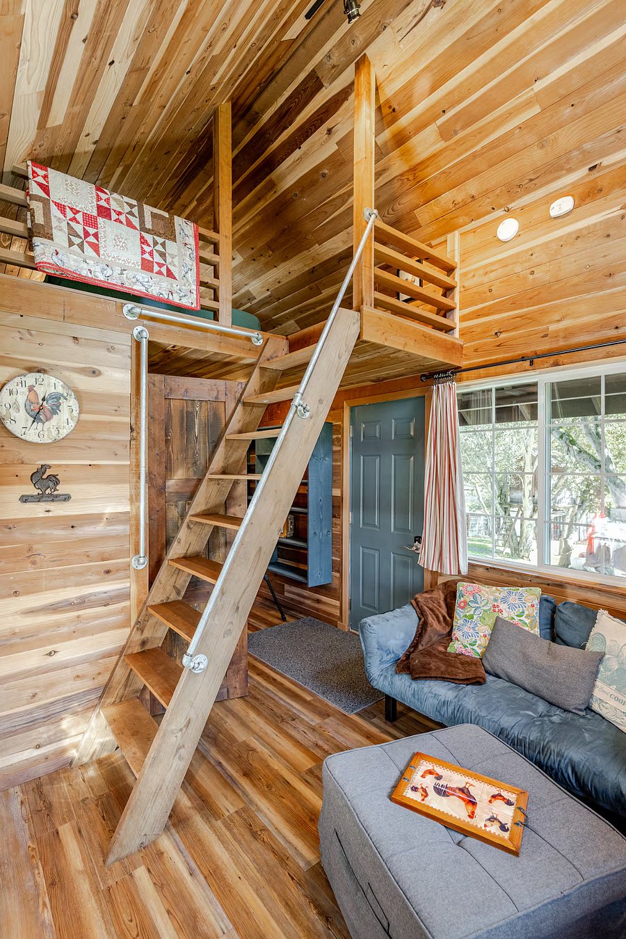 There are several well placed hand rails on the stairs up to the sleep loft.