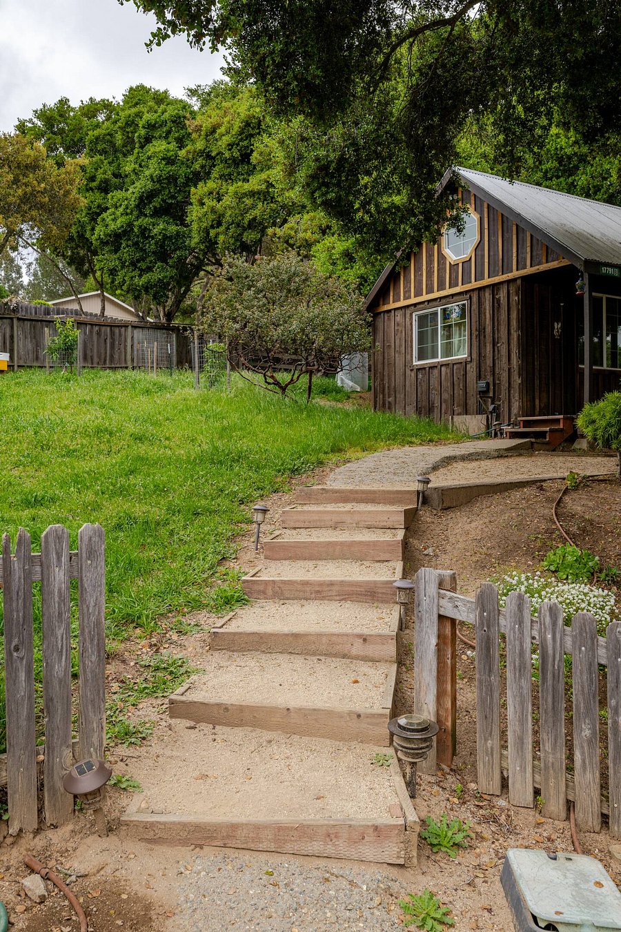 Follow the decomposed granite path past the cottage on your way to the Trailer in the Oaks. The pathway is lit by solar lights at night.
