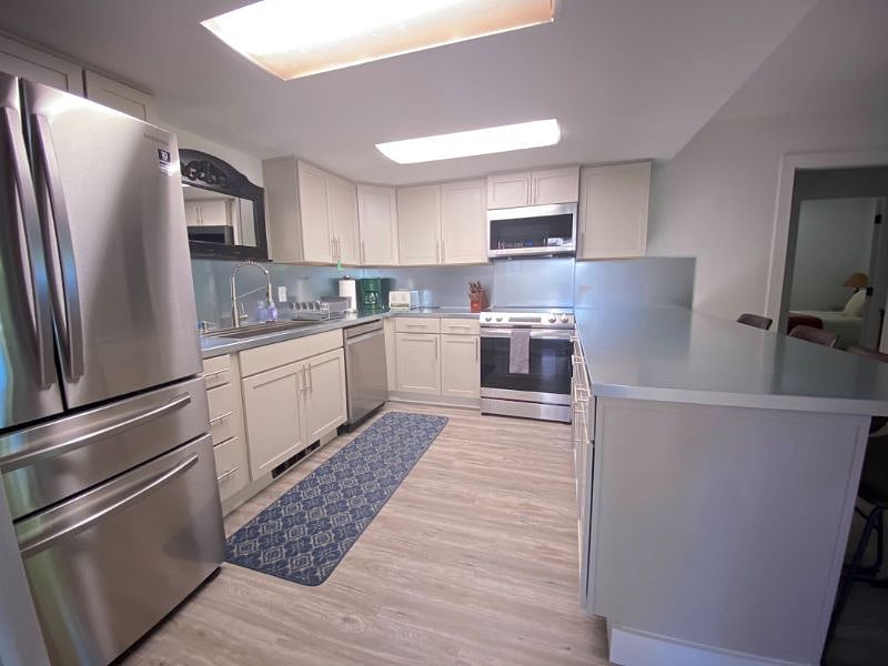 Kitchen with all new appliances, cabinets and flooring.