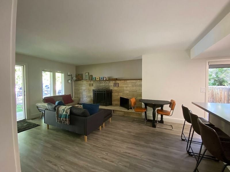 View of living room area with front door to the left.