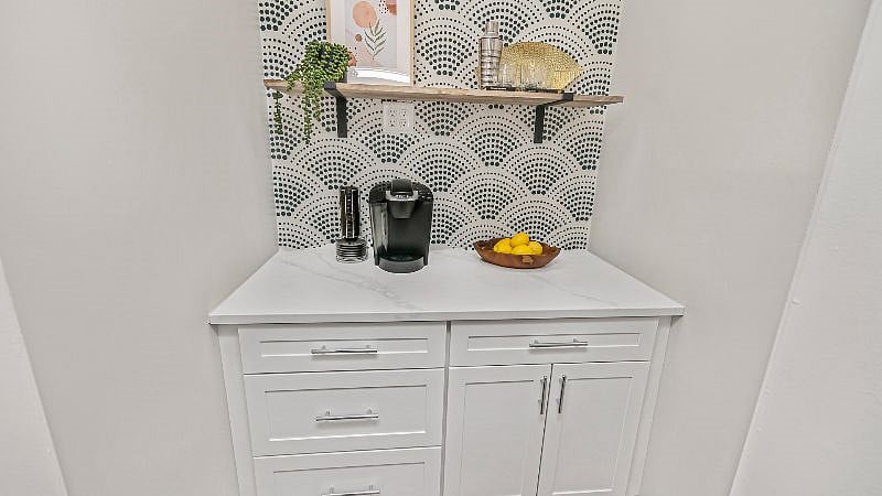 Brew a cup of coffee or mix up a cocktail in this custom built butler's pantry located directly off the kitchen.