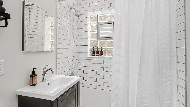 Relax and recharge in the tranquil bathroom with soaker tub and full tile surround.