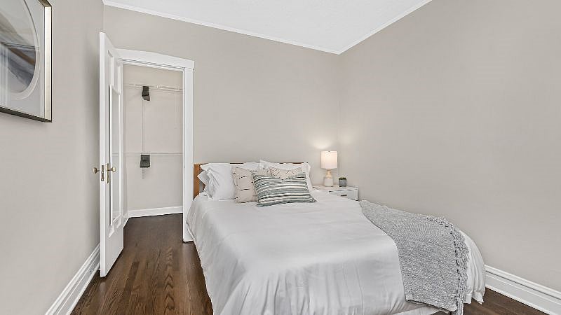 Bedroom 2 offers ample closet space and hangers in the large walk-in closet.