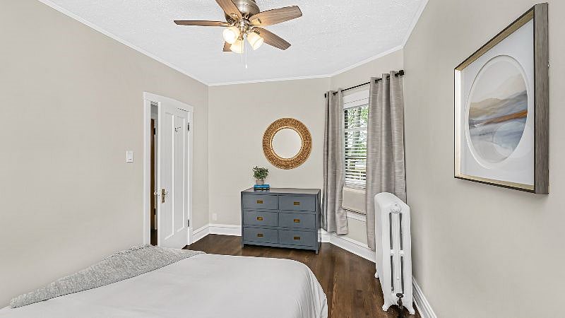 Bedroom 2 offers a full size dresser, remote operated AC, and black-out curtains