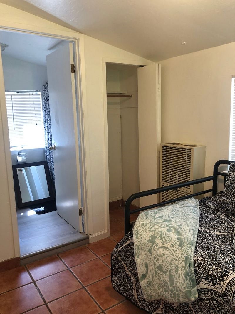 Doorway to bathroom. No bathtub, shower stall only.