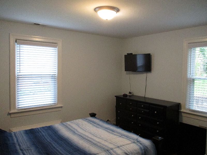 Bedroom with smaller TV