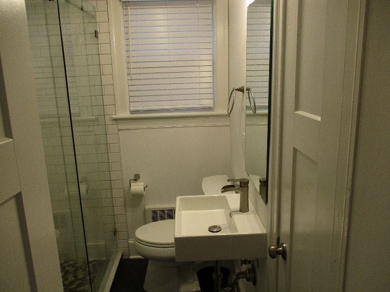 Renovated Bath with tiled shower and multiple showerheads