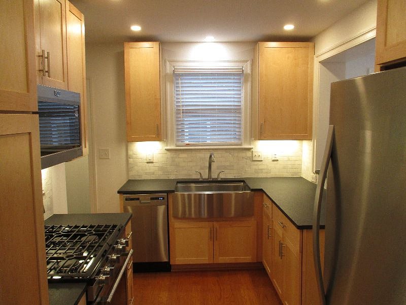 Fully loaded Kitchen with stainless steel farm sink, dishwasher, gas stove, full sized fridge, microwave