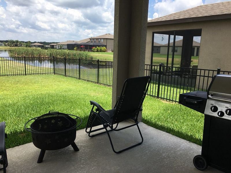 Shaded patio with view of lake
