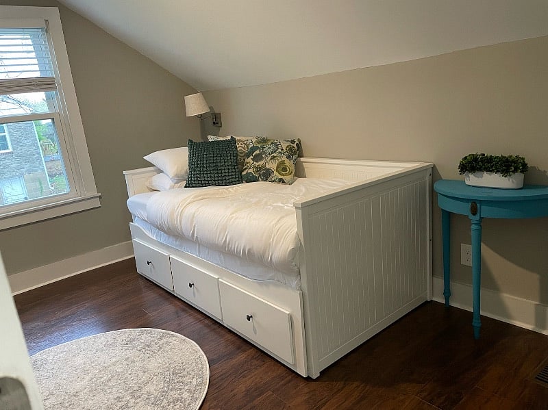 Cozy upstairs room. The bed pulls out to a king size. This room has an attached bathroom.