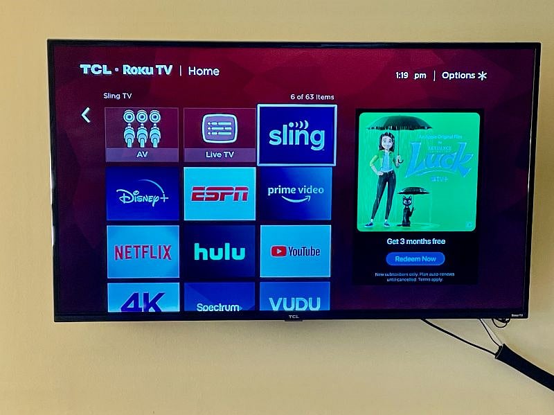 ROKU TV in living room including Sling TV, Hulu, Disney+ streaming channels and local stations