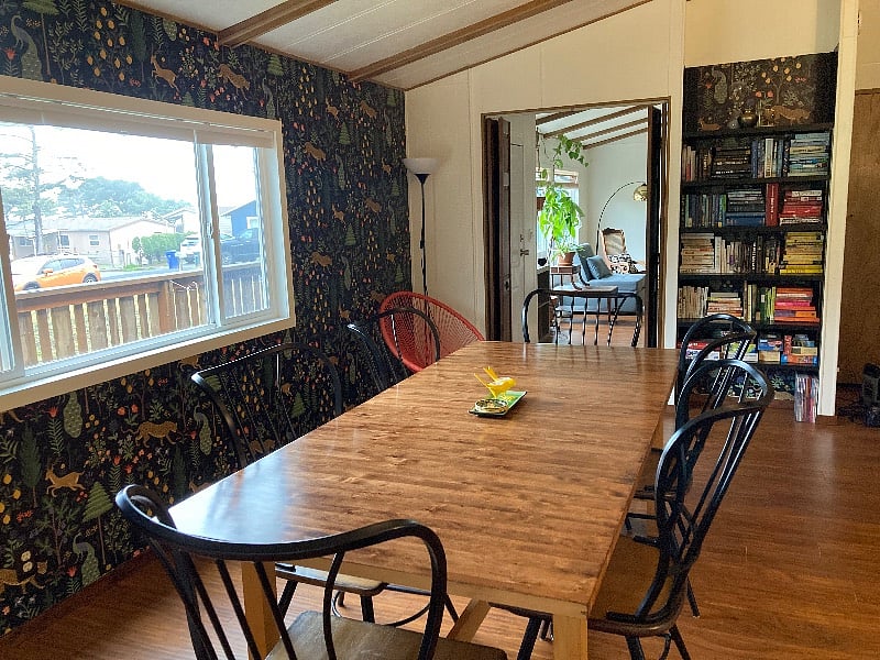 Large dining area with a big table and great lighting.