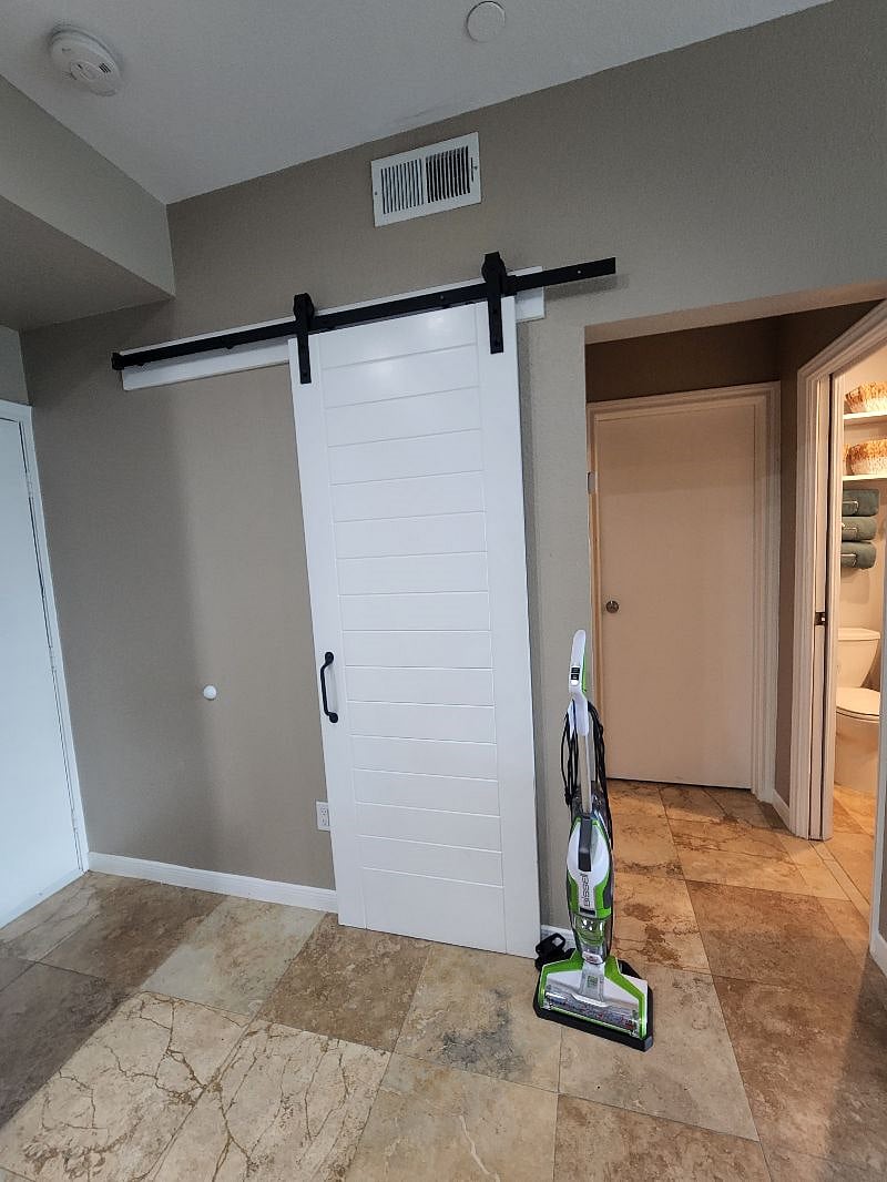 Additional storage space behind the barn door.