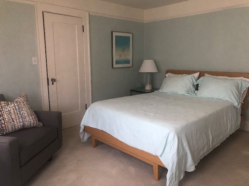 Bedroom #2 with new queen mattress and essential linens and bath towels.