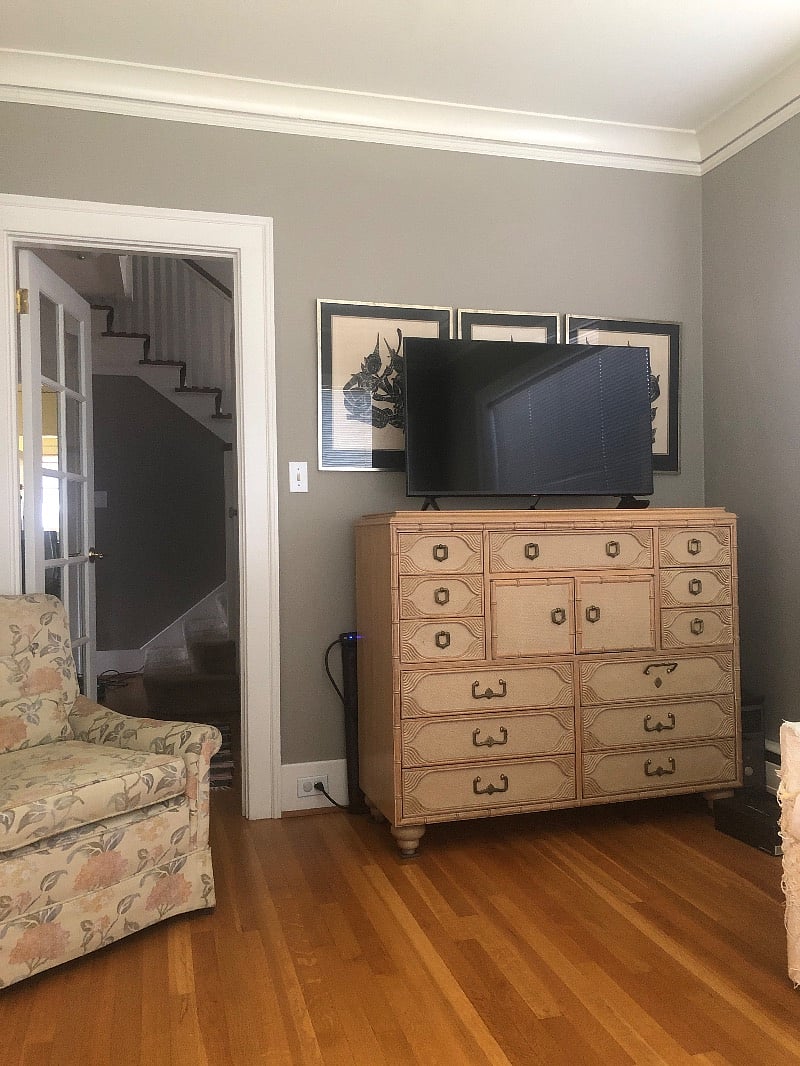 Sun room on main floor has loveseat and chair, TV for streaming.