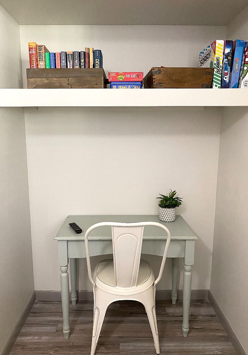 Q1: Desk area with games and books for use; located in bedroom 3