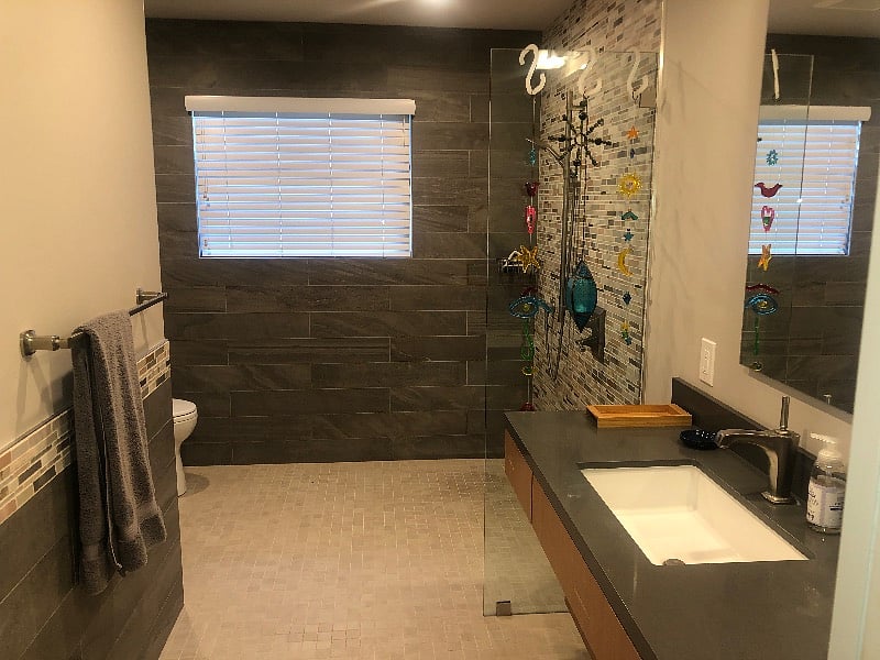 Tiled bathroom with walk in shower measures 12 by 8 feet