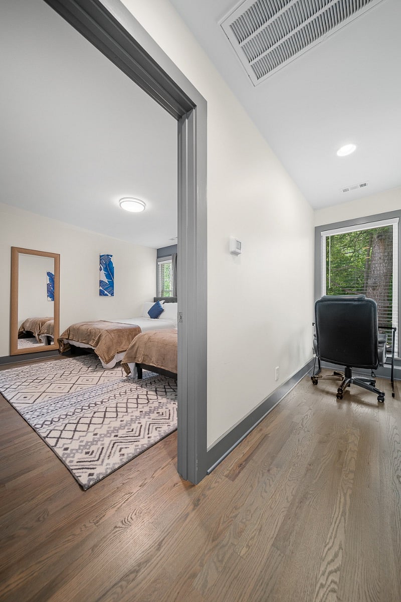 Work space by the window. There is plenty of natural light illuminating this work area to ensure a peaceful environment to complete any task at hand.