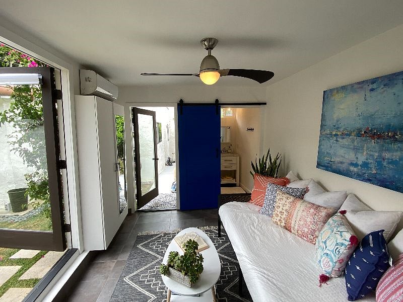 There is a remote controlled ceiling fan in  addition to the heater/AC unit.