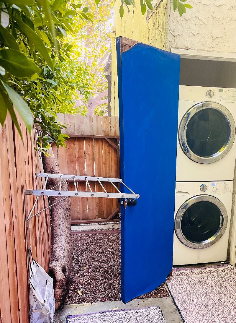 The washer/dryer unit is along the side of the house, and free to use.
