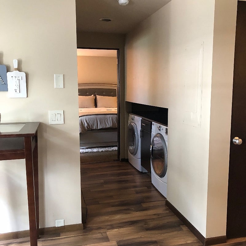laundry adjacent to kitchen and main floor bedroom