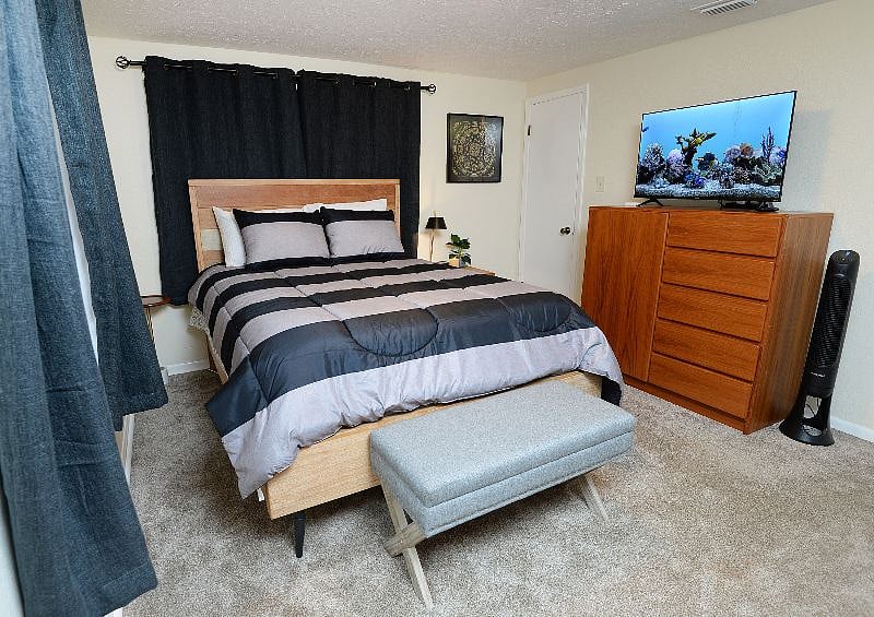 Master Bedroom with blackout curtains and sound machine