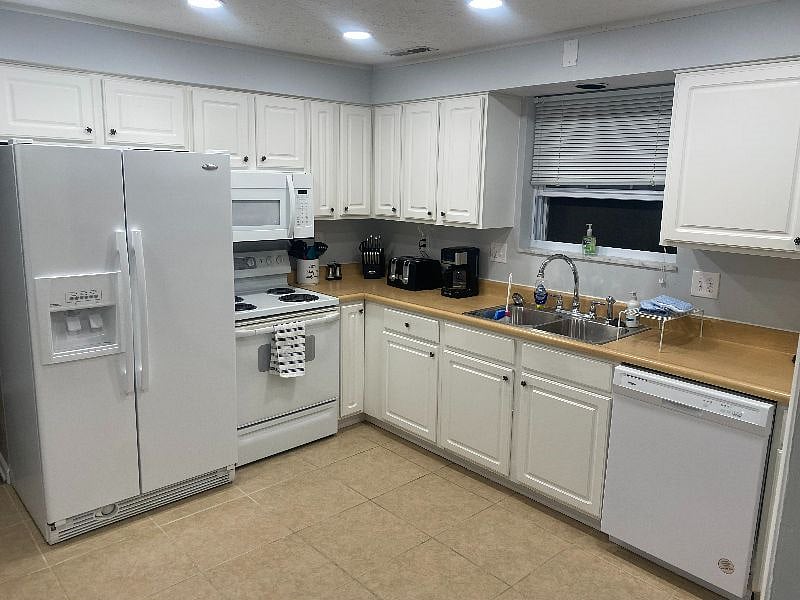 FULLY REMODELED & FULLY EQUIPPED/STOCKED KITCHEN BUILTIN MICROWAVE DISHWASHER, STOVE, REFRIDGERATOR, & KITHENWARE, PLATES, CUPS, SILVERWARE
