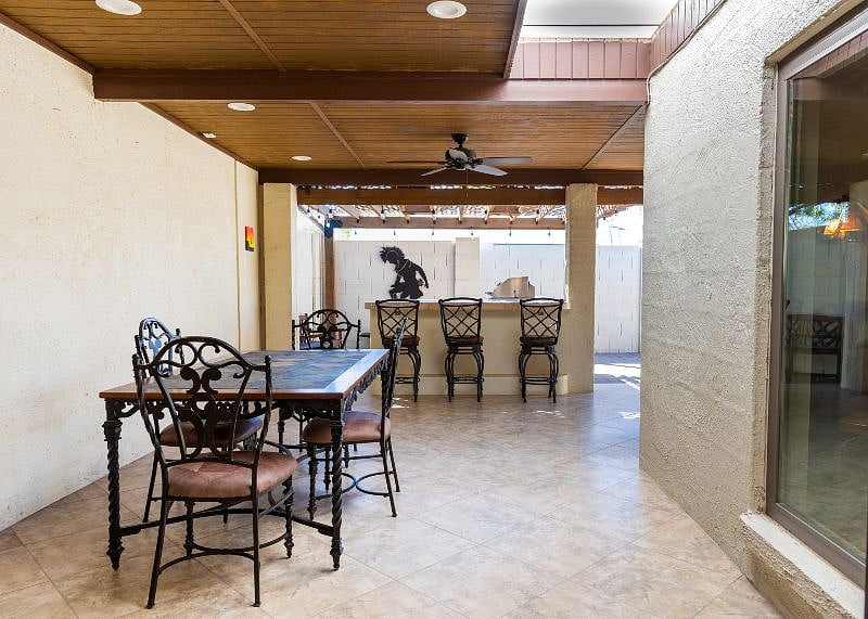 Dining table on covered patio with skylight