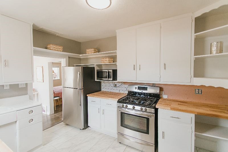 The kitchen boast subway tile backspalsh that was still being installed at the time of this photo.