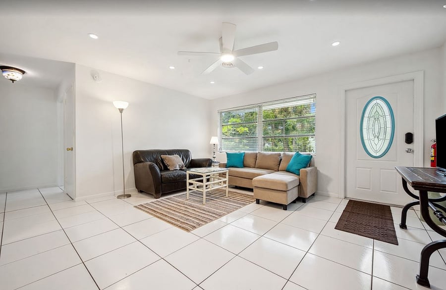 Spacious and bright living area overlooking lush front yard. 