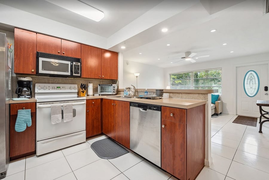 Fully equiped kitchen with fridge, stove/oven, dishwasher, microwave, coffee pot, and toaster over. All dining and cookware included. 